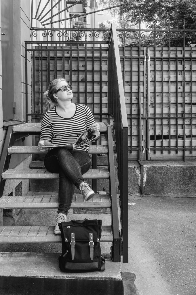 Eva sitting on a staircase